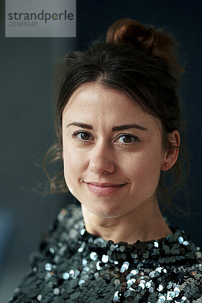 Smiling beautiful woman wearing sequin dress