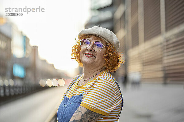 Thoughtful senior woman wearing beret