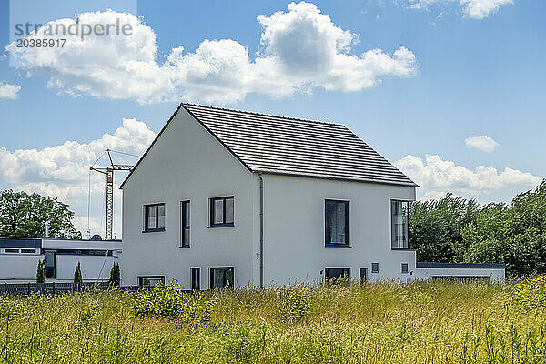 Modern detached house under cloudy blue sky in Bavaria  Germany