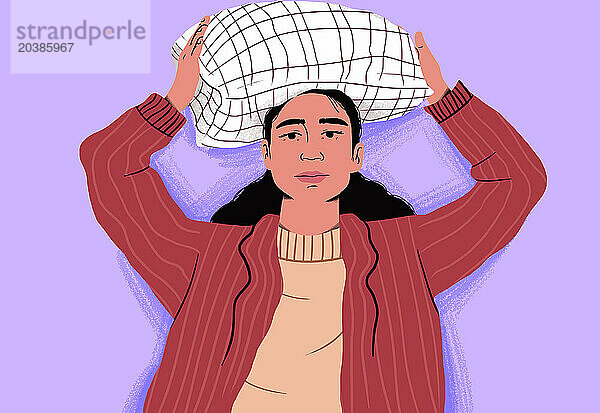 Exhausted woman lying with pillow on head against purple background