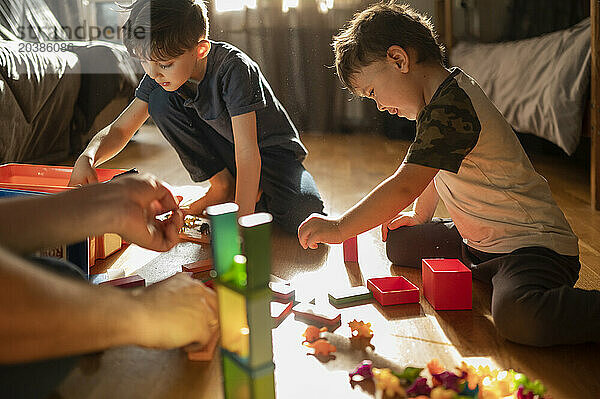 Children playing with block toys at home