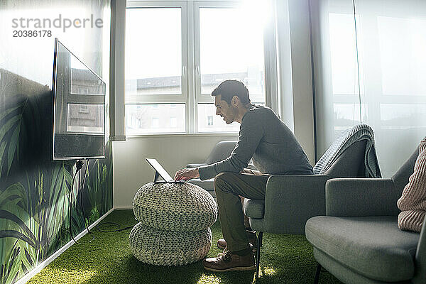 Businessman working on tablet PC in office