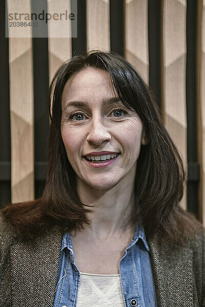 Smiling businesswoman with brown hair