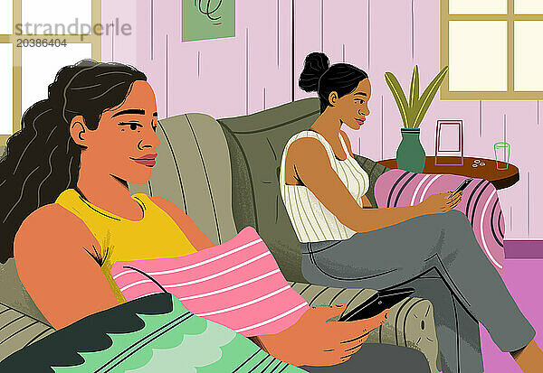 Women using smart phone sitting on sofa at home