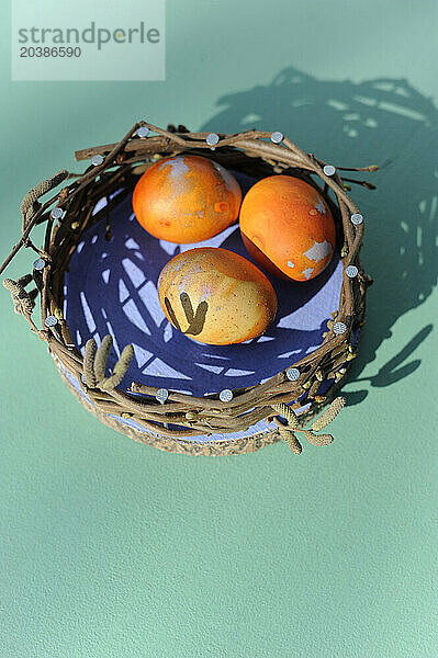 Chicken eggs in DIY decorative Easter nest