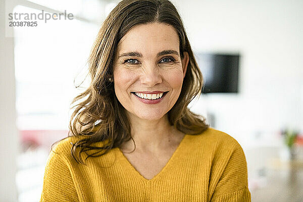 Smiling businesswoman in creative office