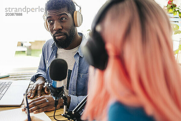 Influencers recording podcast at home