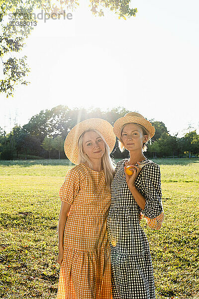 Women wearing hats in park on summer vacation