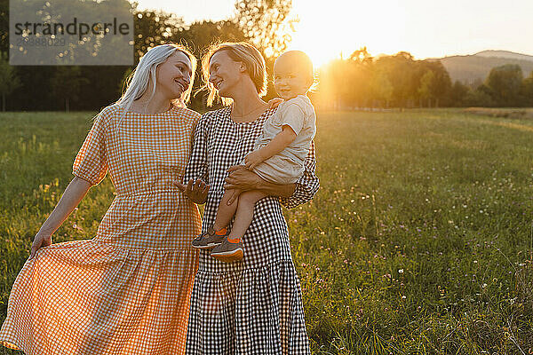 Women wearing checked pattern dress in park