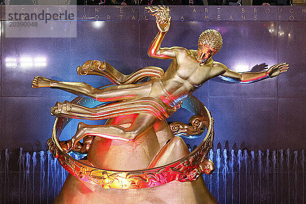 USA. New York City. Manhattan. Rockefeller Center during the winter. Statue Prometheus  by Paul Howard Manship (1885 ? 1966).