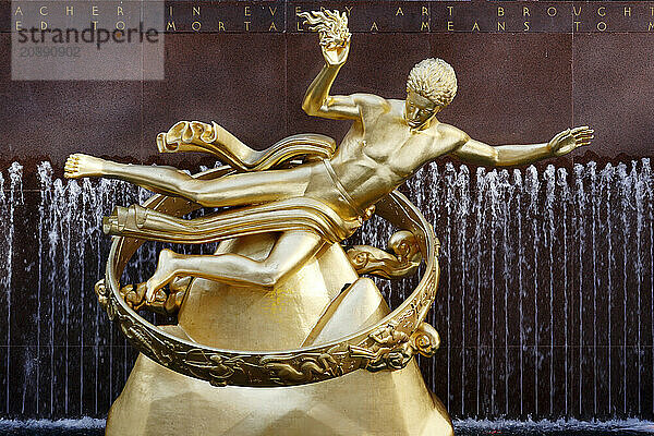 USA. New York City. Manhattan. Rockefeller Center during the winter. Statue Prometheus  by Paul Howard Manship (1885 ? 1966).