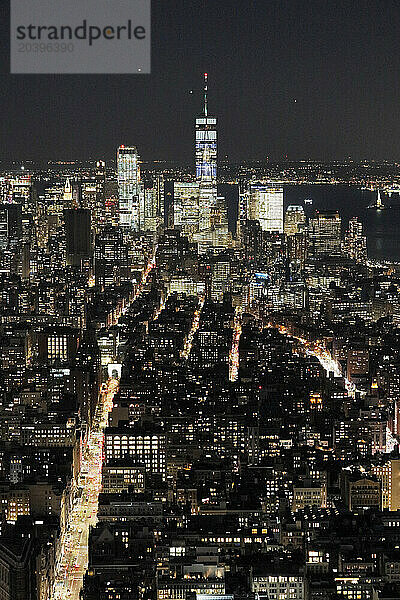 USA. New York City. Manhattan. Empire State Building. View from the top of the building at dusk and night. View of the One World Trade Center  lower town and financial district.