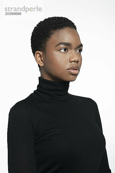 Beautiful woman with turtleneck posing against white background