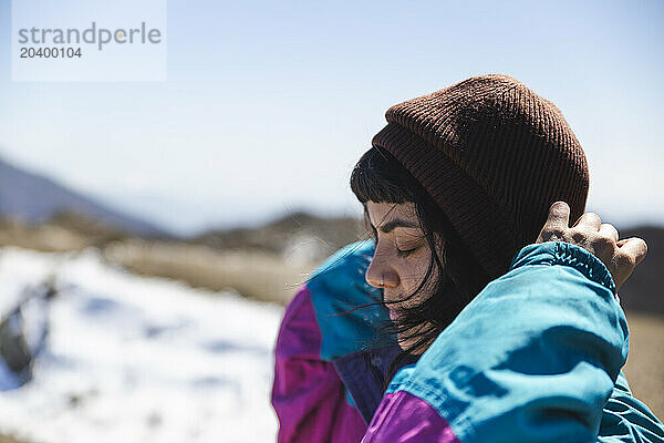 Young woman wearing knit hat in winter