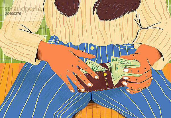 Hands of woman holding wallet with paper currency