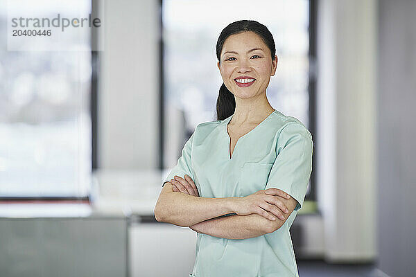 Portrait of smiling nurse in scrubs