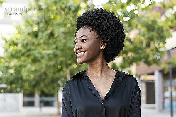 Happy Afro woman wearing black shirt