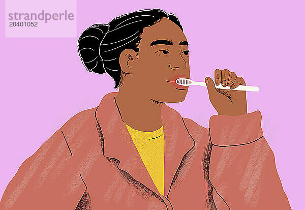 Woman brushing teeth against pink background