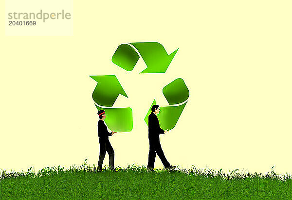 Man and woman carrying large recycling symbol