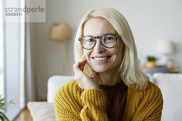 Happy woman wearing eyeglasses at home