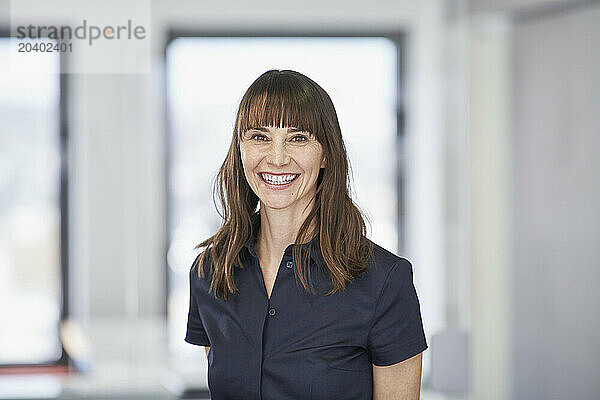 Portrait of smiling businesswoman in office