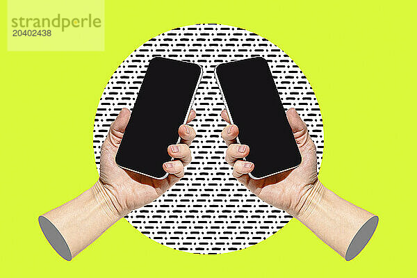 Two hands with smart phones on bright green background