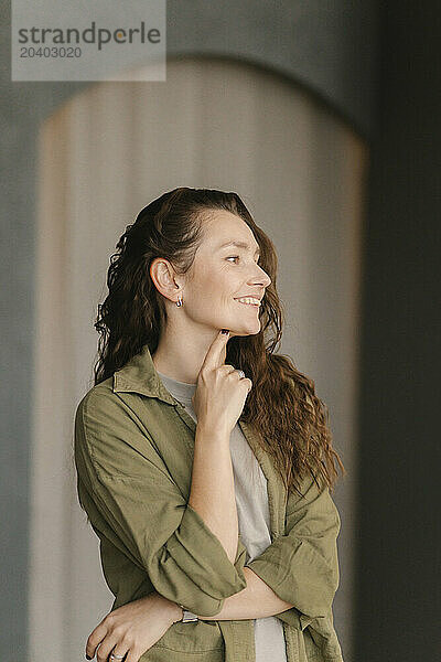 Smiling woman standing in new home