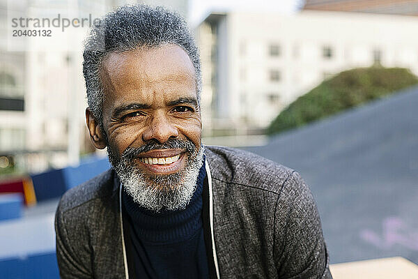 Happy mature businessman with gray hair