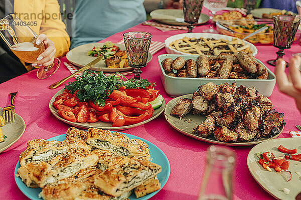 Woman having lunch with family at dining table