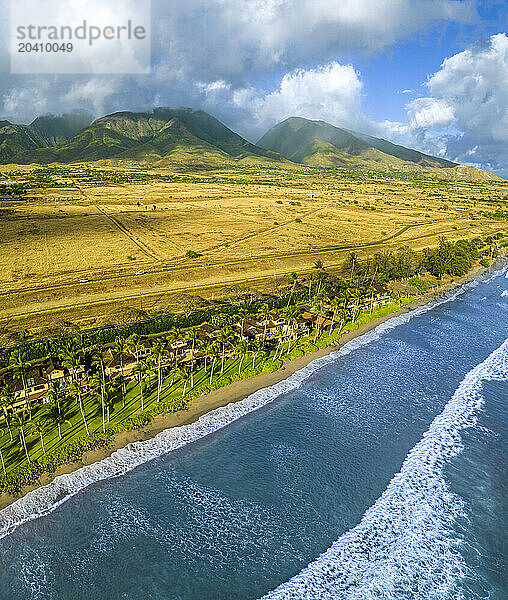 An aerial view of the West Maui Mountains from above the Puamana condos just south of Lahaina  Maui  Hawaii  USA.