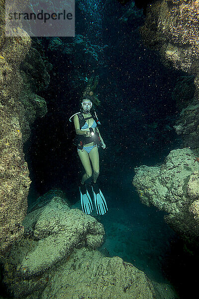 Diver (MR) inside a cavern off the island of Yap  Micronesia.