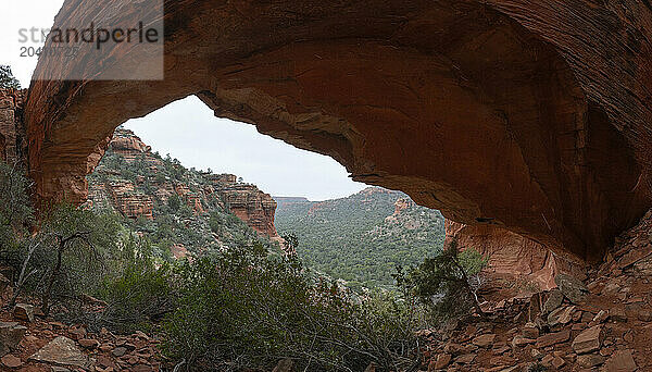 Panoramic image of a natural bridge along a hiking trail in Sedona  Arizona.