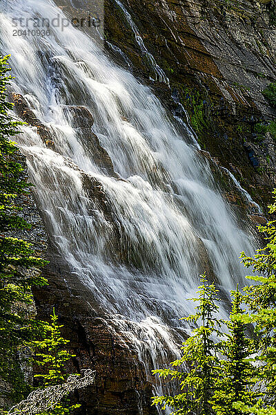 Cascading waterfalls against a rock cliff