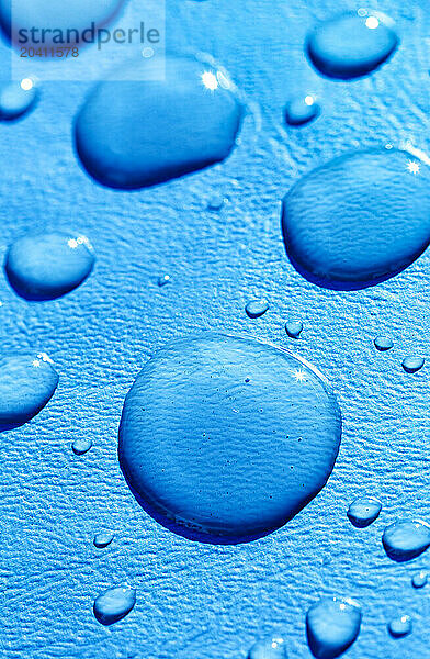 Close up of large waterdroplets on a blue background