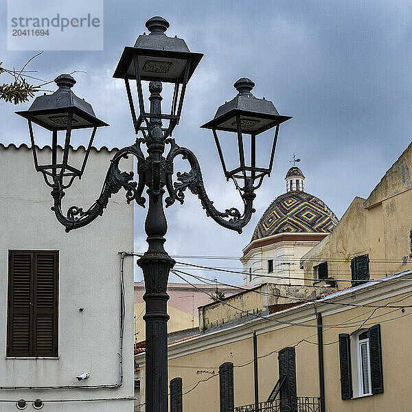 Alghero is a city on the northwest coast of Sardinia  Italy. Encircled by ancient walls  it’s known for its cobblestoned old center.