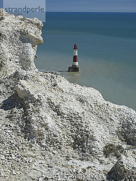 Beachy Head Lighthouse seen from the coast path above with white chalk cliffs on a sunny day  East Sussex  UK © Renzo Frontoni