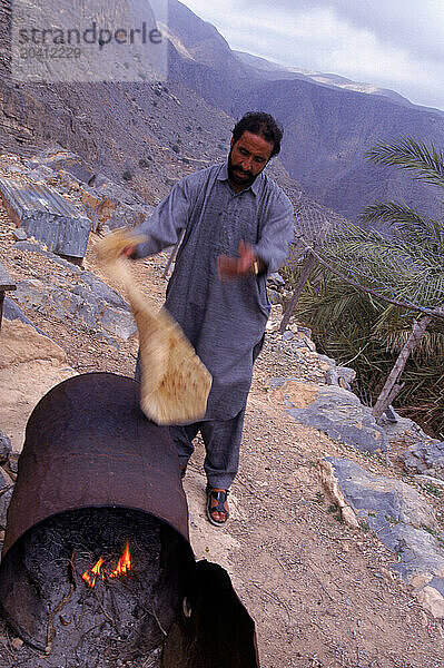 Man making bread  Dubai  United Arab Emirates.