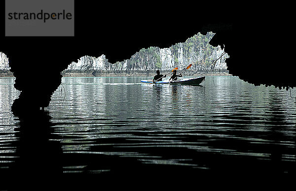 Halong Bay tourists canoeing Kayak