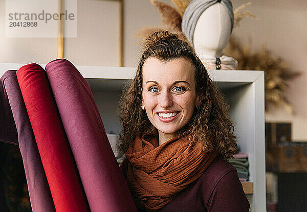 Joyous young woman with curly hair and a radiant smile