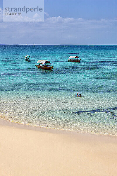 Newly married couple bathing in Changuu (Prison) Island of Zanzibar.