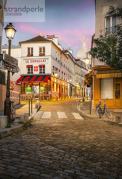 Sunset over Montmartre's Rue du Poteau with Sacré-Cœur Basilica