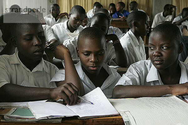 Young girls study at a school room in rural Uganda.