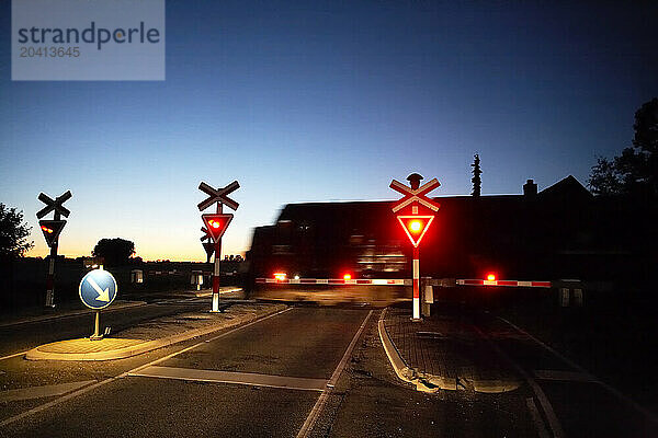 Train crossing at night