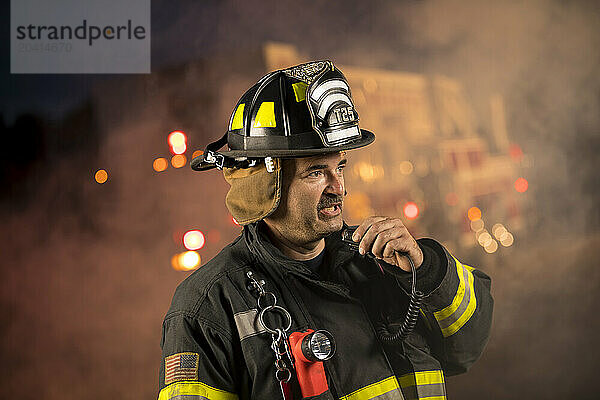 Firefighter communicates on the radio  New Holstein  Wisconsin  USA