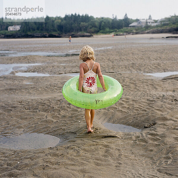 young girl walking on beach