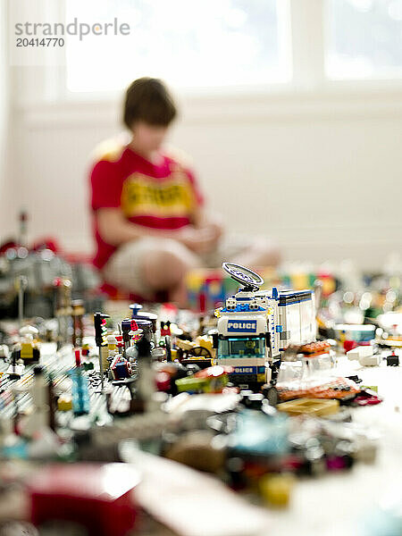 boy plays with toys