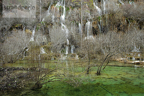 Waterfalls over jutting rocks at the source of the Cuervo river in Guadalajara  Spain.