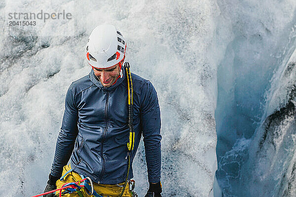 A man going down a crevasse on an Icelandic glacier