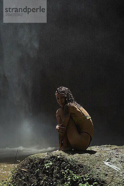 Woman traveler at the waterfall Nung Nung.