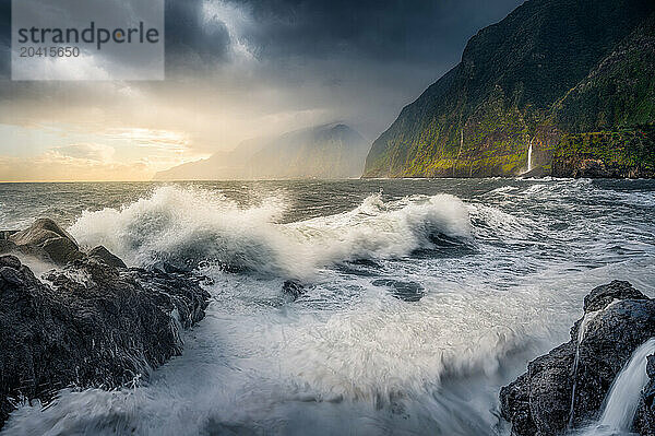 Dramatic Sunrise over Crashing Waves on Madeira's Northern Cliffs